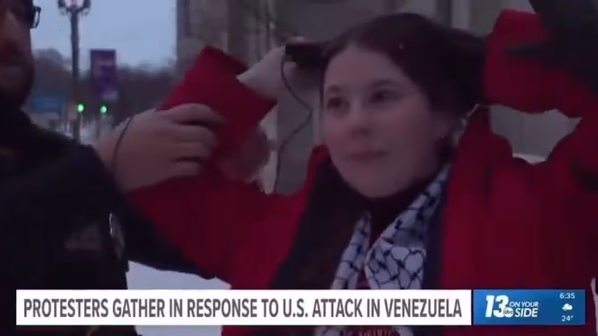 Shocking moment woman is arrested during live TV interview