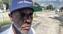 FILE - Jazz Watts, a resident of Sapelo Island, wears a hat that reads