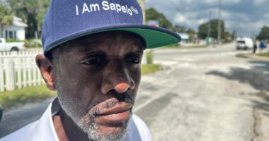 FILE - Jazz Watts, a resident of Sapelo Island, wears a hat that reads