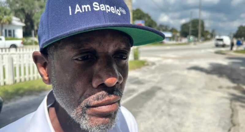 FILE - Jazz Watts, a resident of Sapelo Island, wears a hat that reads