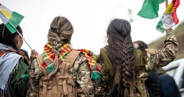 Syrian militiaman shows off what he claims to be severed Kurdish fighter's braid as Damascus asserts control