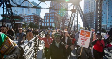 FILE - A crowd marches across the Lefty O