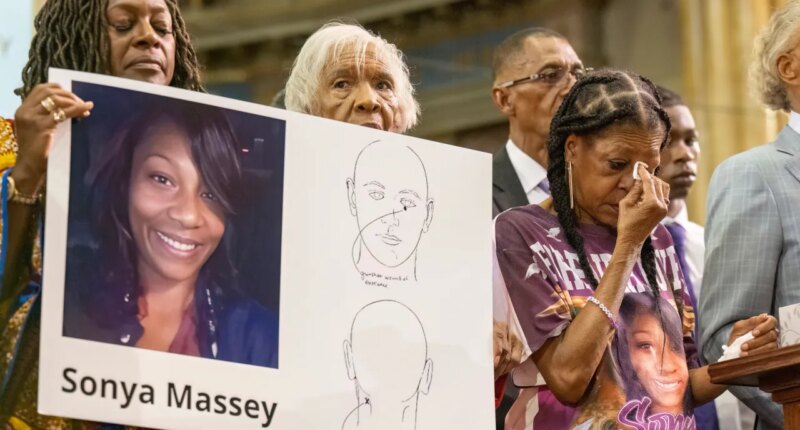 FILE - Donna Massey, center right, wipes tears from her face as she listens to Rev. Al Sharpton, right, speak during a press conference over the shooting death of her daughter, Sonya, who was killed by Illinois sheriff