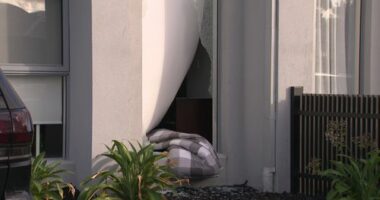 A doona was seen hanging out of the smashed window of the Altona North townhouse.