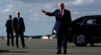 President Donald Trump points after arriving at Palm Beach International Airport on Air Force One, Friday, Jan. 16, 2026, in West Palm Beach, Fla. (AP Photo/Julia Demaree Nikhinson)