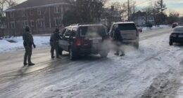 An ICE agent grabs the door handle of her car moments before the shooting.