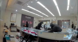 Video shows masked robbers crash car through jewelry store entrance, steal owner's gun in brazen heist