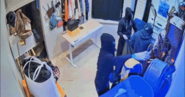 Video shows terrifying moment masked California burglars blitz high-end store, escape in luxury SUVs