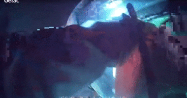 An officer pulls an injured man out of a vehicle following a crash