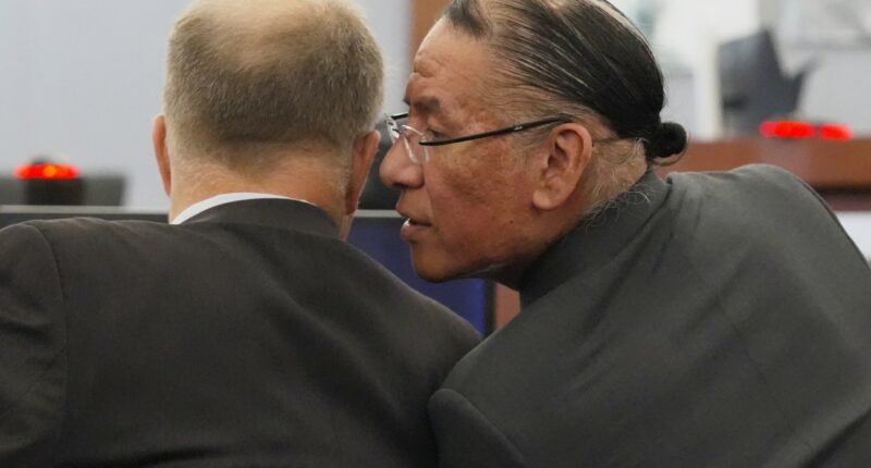 Nathan Chasing Horse, right, talks to his attorney Craig Mueller during his trial on charges of sexually abusing Indigenous women and girls Tuesday, Jan. 13, 2026, in Las Vegas. (AP Photo/Ty ONeil)