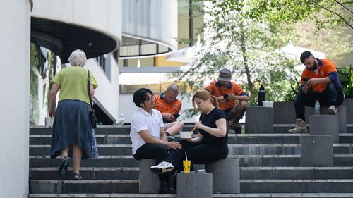 Generic scenes of young professional workers in suits in the CBD
