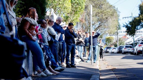 Potential bidders attend an auction