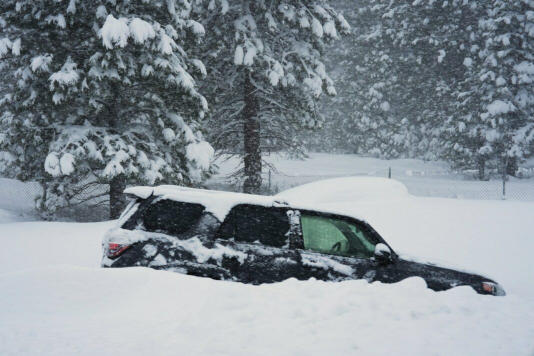 A vehicle is buried in snow during a storm on Tuesday, Feb. 17, 2026 in Truckee Calif. (AP Photos/Brooke Hess-Homeier)
