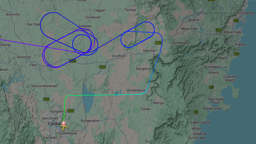 A map of the flight shows the plane circled over NSW before diverting to Canberra.