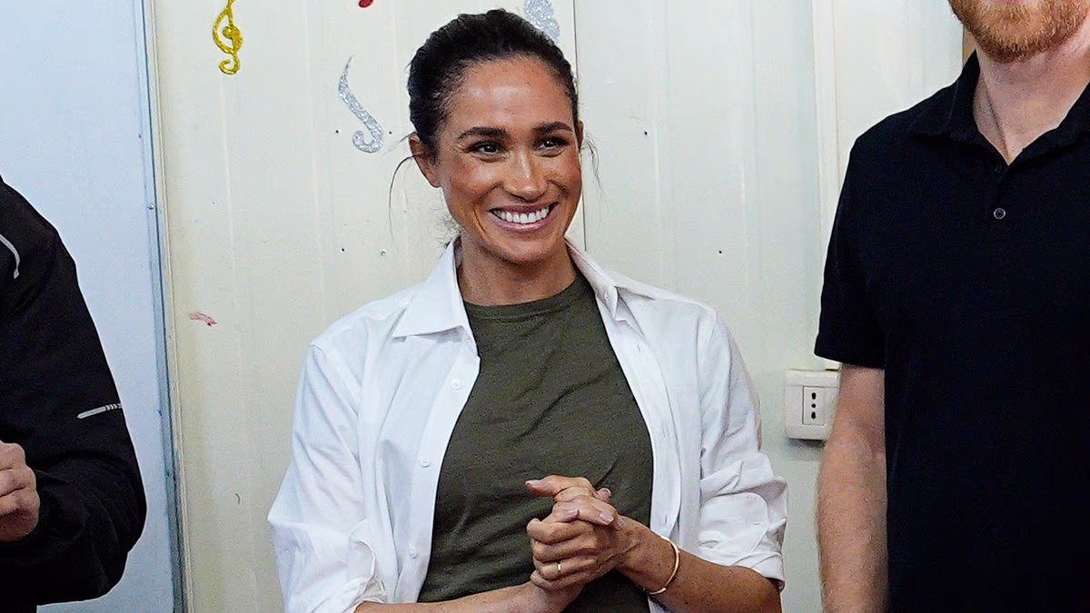 Down-to-earth Meghan has no time to worry about creased trousers