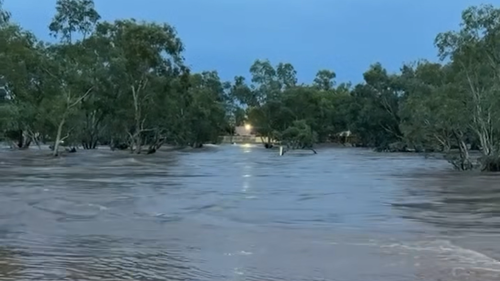 The Todd River was overflowing after heavy rain fell in Alice Springs last night.