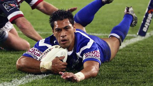 SYDNEY, AUSTRALIA - OCTOBER 3: Matt Utai of the Bulldogs dives over for a try during the NRL Grand Final  between the Sydney Roosters and the Bulldogs held at Telstra Stadium, October 3, 2004 in Sydney, Australia. (Photo by Chris McGrath/Getty Images) *** Local Caption *** Matt Utai