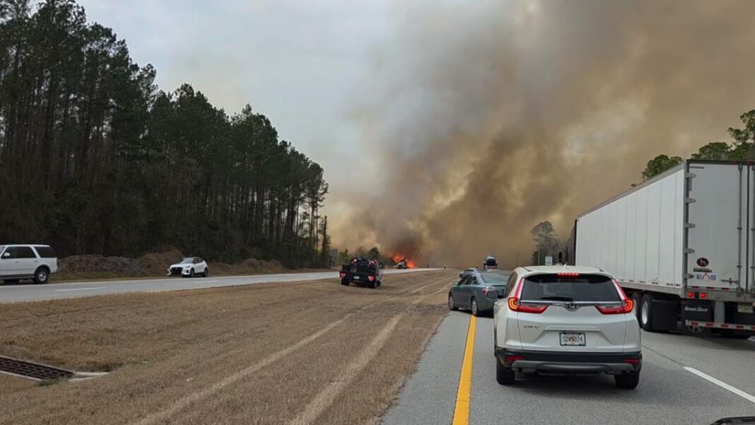 Highway 82 reopens as firefighters battle large Waynesville wildfire