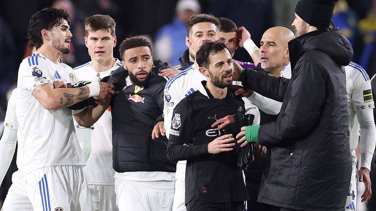 Inside the chaos after Man City's win at Leeds: Pep Guardiola involved in stand-off with fans who hurled x-rated insults at him, star is led away after goading supporters and players clash as Daniel Farke is sent off