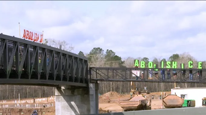 Local group hangs "Abolish ICE" banner on SR-21