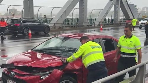 A man has been charged after he allegedly carjacked a woman and later crashed the vehicle on Brisbane's ﻿Story Bridge.