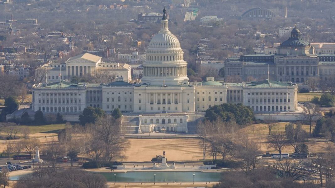 Man running toward US Capitol holding shotgun arrested by police