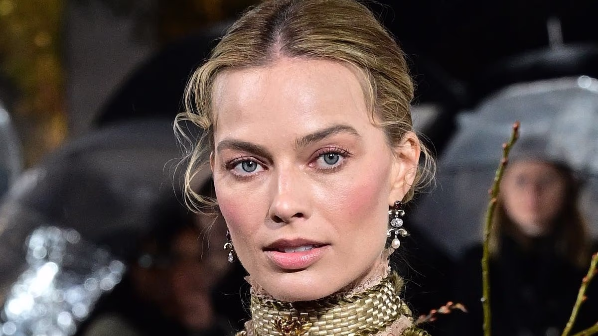 Margot Robbie continues her period fashion parade in a racy sheer corset gown as she joins her on-screen love interest Jacob Elordi at the Wuthering Heights UK premiere