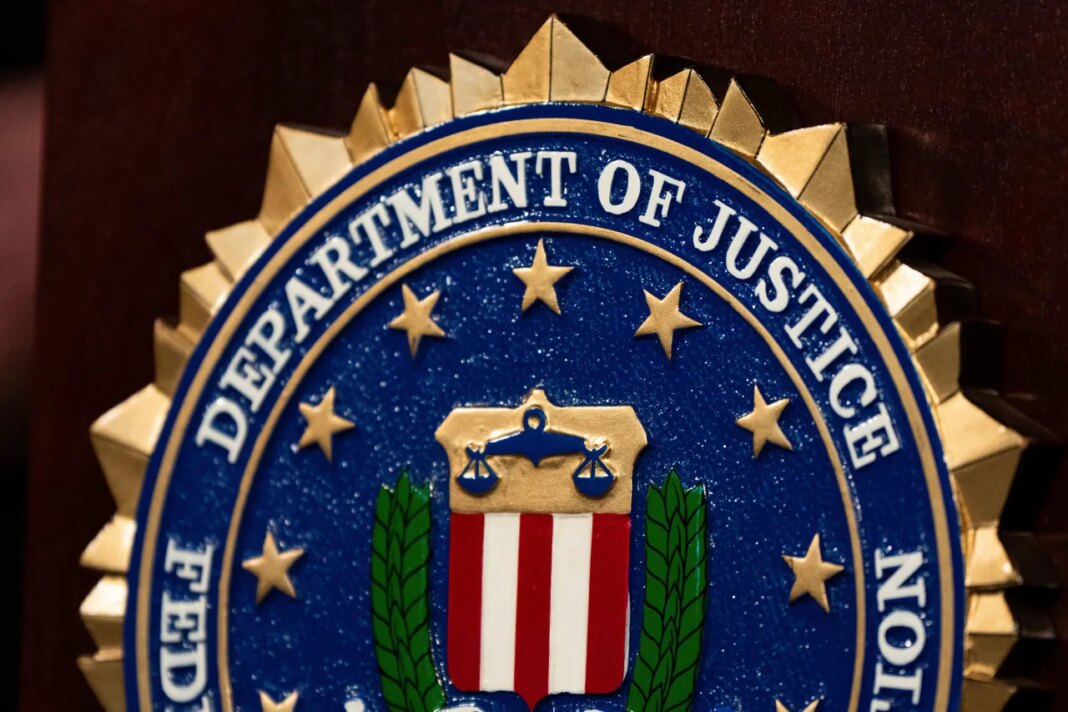 FILE - An FBI seal is displayed on a podium before a news conference at the field office in Portland, Ore., Thursday, Jan. 16, 2025. (AP Photo/Jenny Kane, File)