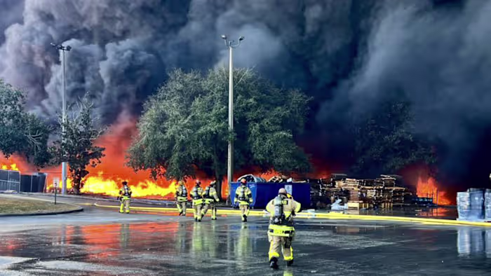 PHOTOS: ‘Sprawling’ 4-alarm blaze sparked by brush fire rips through Osceola County business