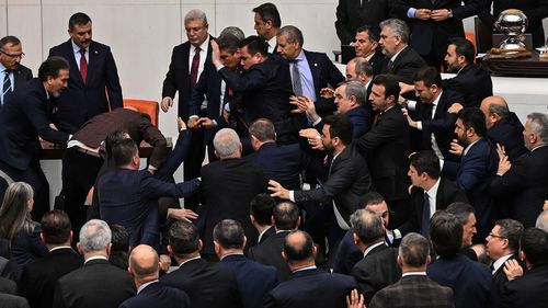 Turkey's ruling party and opposition lawmakers clash over the appointment of Istanbul Chief Prosecutor Akin Gurlek as justice minister at the parliament in Ankara, Turkey, Wednesday, Feb. 11, 2026. (Ugur Yildirim/DIA Photo via AP)