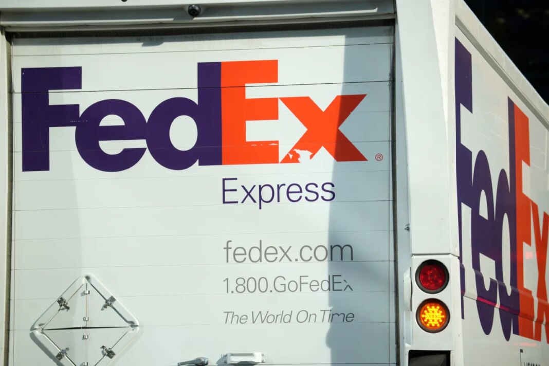 FILE - The company logo is shown on a FedEx delivery van, Sept. 13, 2023, in downtown Denver. (AP Photo/David Zalubowski, File)