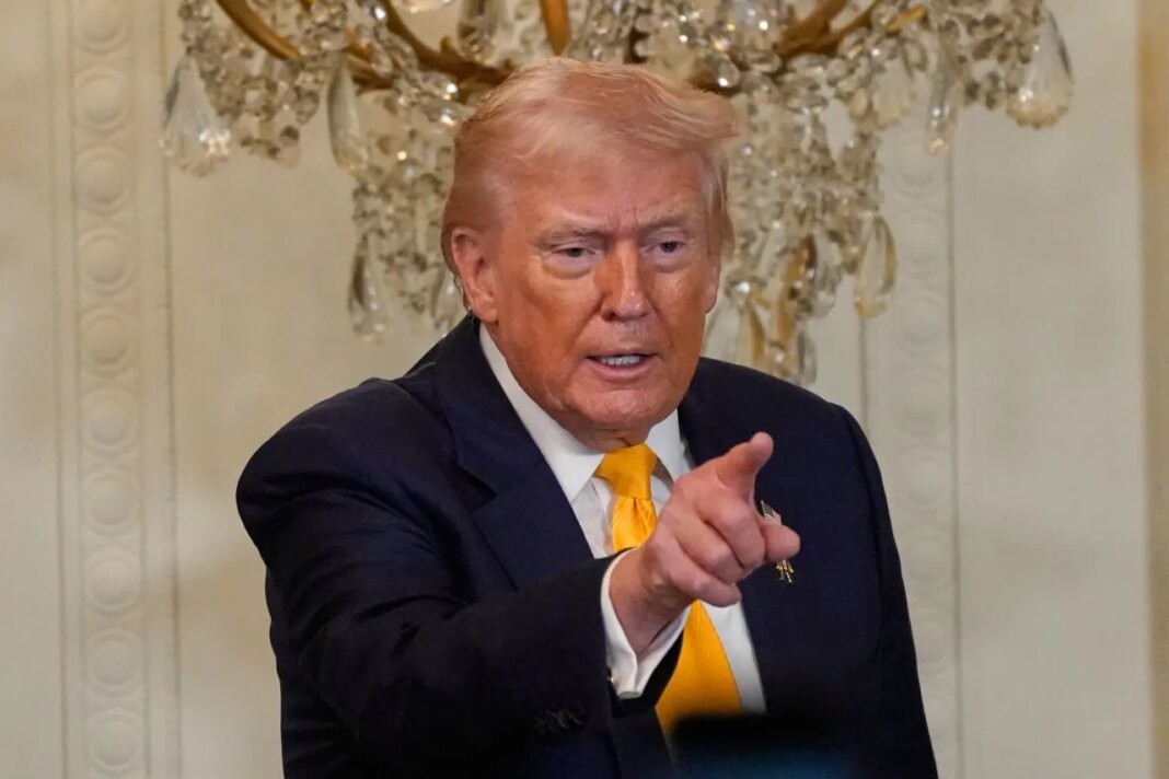 President Donald Trump gestures during a Black History Month event in the East Room of the White House, Wednesday, Feb. 18, 2026, in Washington. (AP Photo/Nathan Howard)