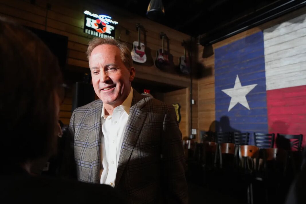 Texas Attorney General Ken Paxton, a Republican candidate for the U.S. Senate, speaks to a supporter during a campaign event, Monday, Feb. 16, 2026, in Tyler, Texas. (AP Photo/Julio Cortez)