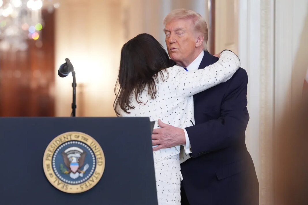 Allyson Phillips, the mother of Laken Riley, is hugged by President Donald Trump, during an event to proclaim 