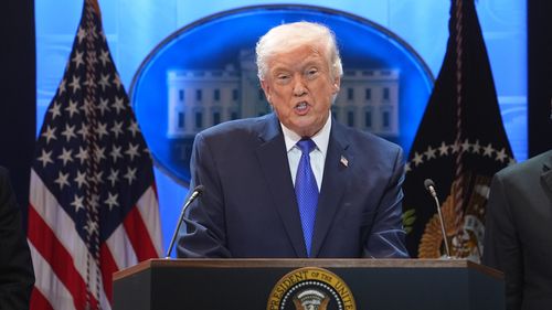 President Donald Trump speaks during a press briefing at the White House on Friday, February 20 in Washington.