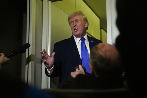 President Donald Trump speaks with reporters aboard Air Force One, Monday, Feb. 16, 2026, en route to Washington from West Palm Beach, Fla. 