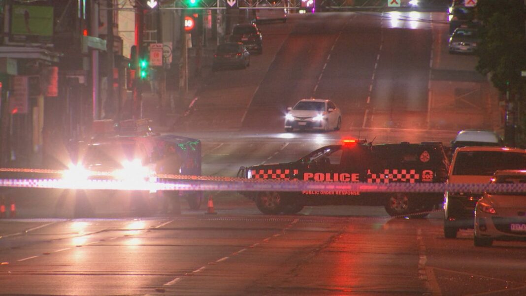 A manhunt is under way after two young men were allegedly stabbed near Melbourne's CBD this morning.Police said the 21-year-old and 22-year-old were set upon on Palmer Street in Collingwood at about 3.15am.