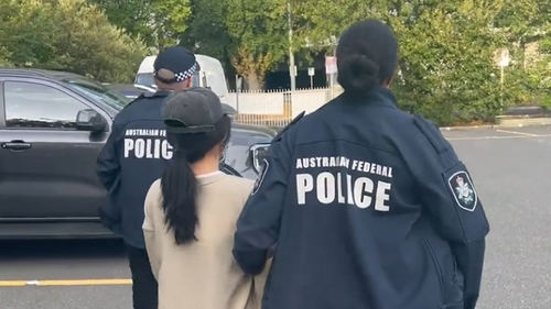 Australia's federal and intelligence officers have charged two more Chinese nationals with foreign interference after they allegedly collected information about a Buddhist association in Canberra. 