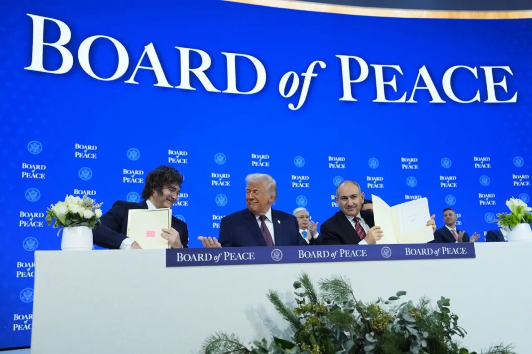 From left, Javier Milei, President of Argentina, President Donald Trump, and Nikol Pashinyan, Prime Minister of Armenia, during a signing of the Board of Peace charter during the Annual Meeting of the World Economic Forum in Davos, Switzerland, Thursday, Jan. 22, 2026. (AP Photo/Evan Vucci)