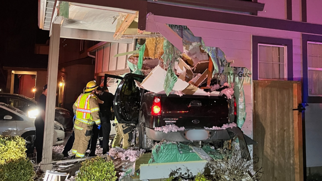 Video: Truck soars through air, crashes into Oregon home