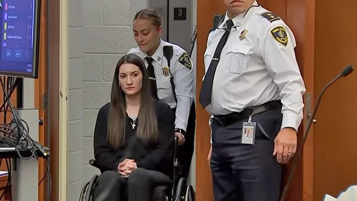 Wheelchair-bound mom accused of killing 3 kids is pushed into court