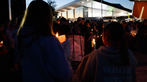 Thousands of people stood in silence at a vigil last night to honour 22-year-old Aidan Becker.
