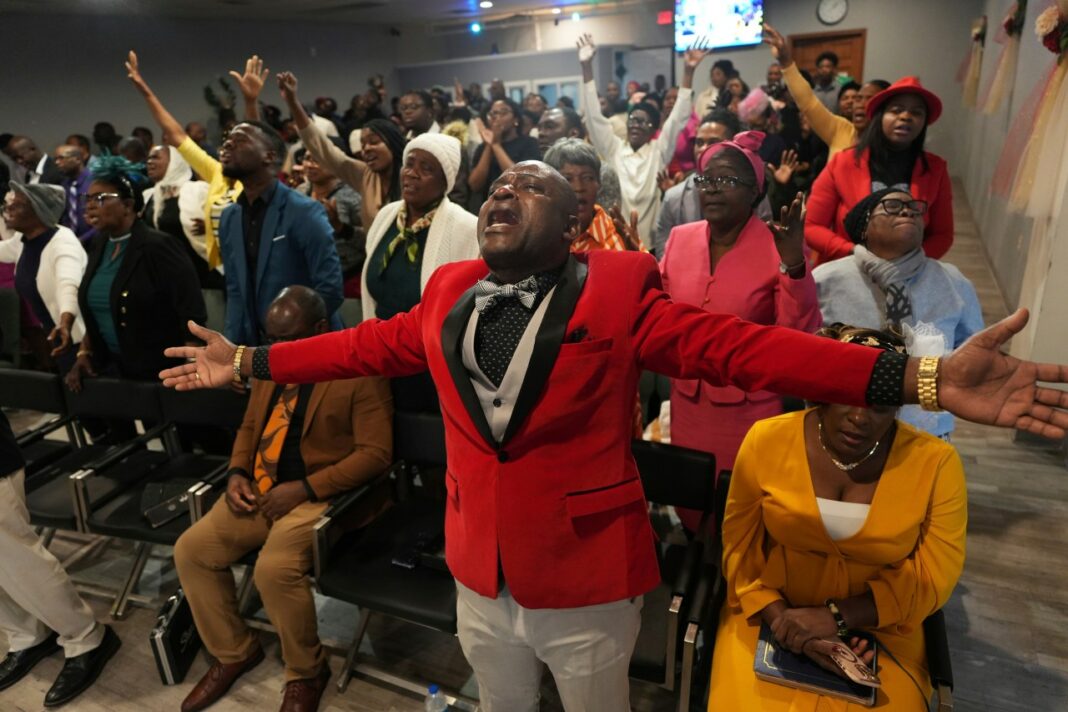 FILE - Jean-Michel Gisnel cries out while praying with other congregants at the First Haitian Evangelical Church of Springfield, Jan. 26, 2025, in Springfield, Ohio. (AP Photo/Luis Andres Henao, file)