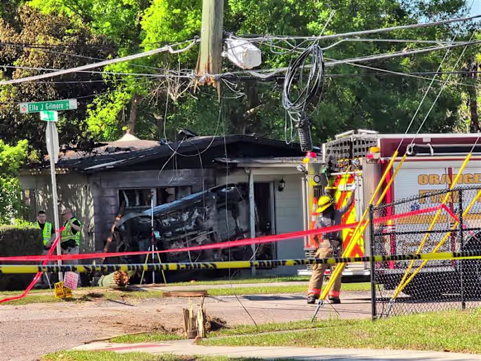 2 dead after car crashes into South Apopka home, catches fire