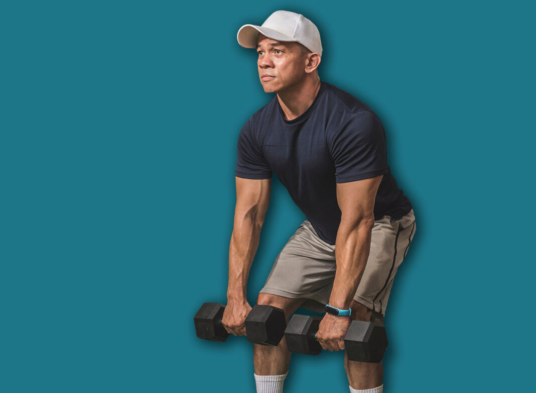 A fit man and his protege does dumbbell romanian deadlifts at a home gym.