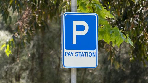 Pay station parking sign