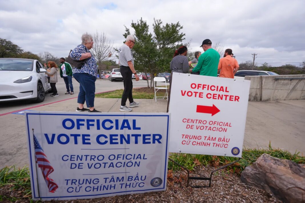 Primary voters arrive to cast ballots at an official vote center in Dallas, Tuesday, March 3, 2026. (AP Photo/LM Otero)