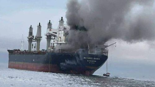 A Thai cargo vessel on fire in the Straits of Hormuz.