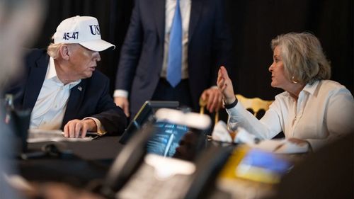 Donald Trump speaks to White House Chief of Staff Susie Wiles.