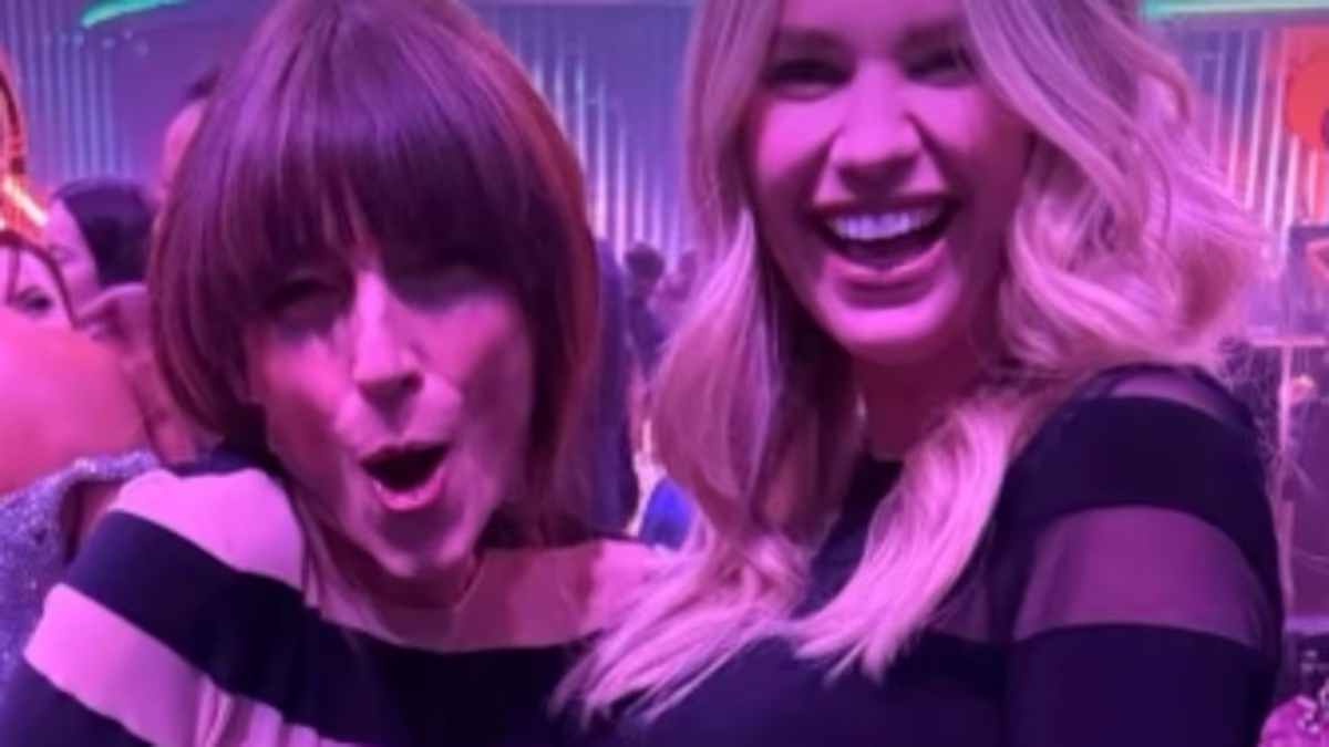 Davina McCall and pregnant Hannah Cooper twin in matching mesh striped dresses at the 2026 BRITs